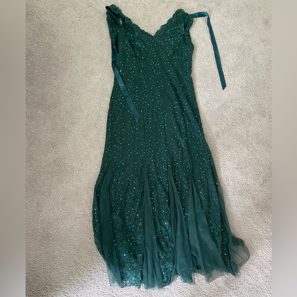 Emerald green, lace and sequin, form fitting, tie back, and mermaid bottom dress